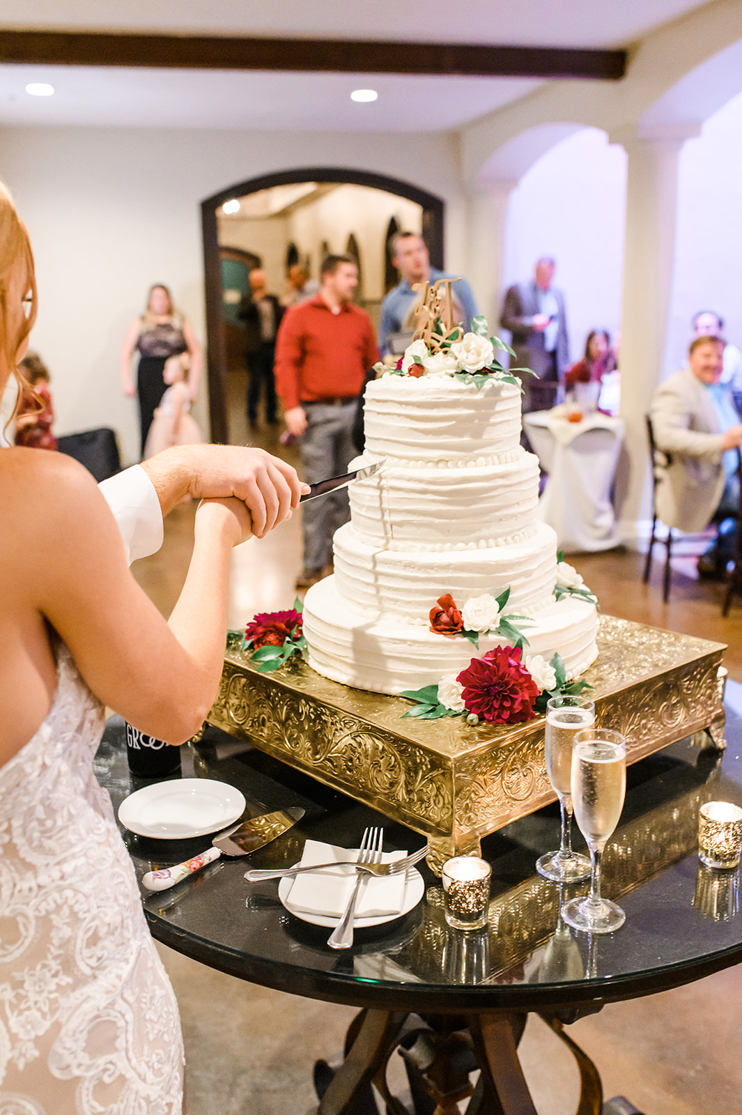 Real WED Bride Taylor Moseley cutting cake at her reception